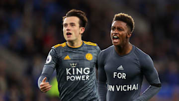 CARDIFF, WALES - NOVEMBER 03: Demarai Gray of Leicester City celebrates with Ben Chilwell of Leicester City after scoring his team's first goal by revealing a commemorative for Vichai Srivaddhanaprabha during the Premier League match between Cardiff City and Leicester City at Cardiff City Stadium on November 3, 2018 in Cardiff, United Kingdom. (Photo by Richard Heathcote/Getty Images)
