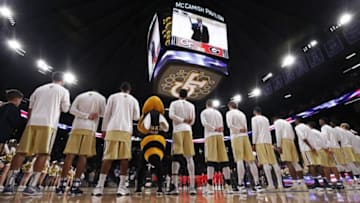 Dec 20, 2016; Atlanta, GA, USA; Georgia Tech Yellow Jackets mascot Buzz stands with basketball players during the national anthem before their game against the Georgia Bulldogs at McCamish Pavilion. Mandatory Credit: Jason Getz-USA TODAY Sports