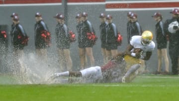 Oct 8, 2016; Raleigh, NC, USA; Notre Dame Fighting Irish wide receiver C.J. Sanders (3) is tackled by North Carolina State Wolfpack cornerback Dravious Wright (8) in the first quarter at Carter-Finley Stadium. Mandatory Credit: Matt Cashore-USA TODAY Sports