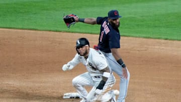 Apr 12, 2021; Chicago, Illinois, USA; Cleveland Indians shortstop Amed Rosario (1) makes a double play against Chicago White Sox third baseman Yoan Moncada (10) during the sixth inning at Guaranteed Rate Field. Mandatory Credit: Mike Dinovo-USA TODAY Sports