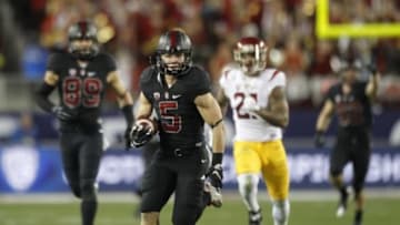 Dec 5, 2015; Santa Clara, CA, USA; Stanford Cardinal running back Christian McCaffrey (5) runs for a first down against the Southern California Trojans in the second quarter in the Pac-12 Conference football championship game at Levi