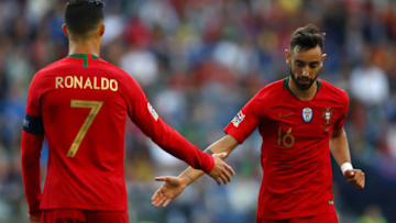 PORTO, PORTUGAL - JUNE 09: Cristiano Ronaldo of Portugal speaks with Bruno Fernandes of Portugal during the UEFA Nations League Final between Portugal and the Netherlands at Estadio do Dragao on June 09, 2019 in Porto, Portugal. (Photo by Dean Mouhtaropoulos/Getty Images)