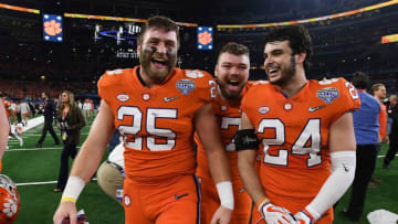 Clemson tight end J.C. Chalk (25), linebacker James Skalski (47), and safety Nolan Turner (24) after the Tigers 30-3 win over Notre Dame in the Goodyear Cotton Bowl at AT&T stadium in Arlington, TX Saturday, December 29, 2018.Clemson Notre Dame Goodyear Cotton Bowl