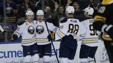 Feb 4, 2016; Buffalo, NY, USA; Buffalo Sabres center Sam Reinhart (23) celebrates his goal against the Boston Bruins with b3#2 and other teammates during the second period at First Niagara Center. Mandatory Credit: Kevin Hoffman-USA TODAY Sports