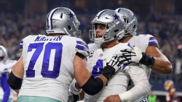 ARLINGTON, TEXAS - NOVEMBER 22: Zack Martin #70 of the Dallas Cowboys celebrates the fourth quarter touchown by Dak Prescott #4 of the Dallas Cowboys against the Washington Redskins at AT&T Stadium on November 22, 2018 in Arlington, Texas. (Photo by Richard Rodriguez/Getty Images)