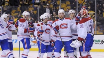 Nov 22, 2014; Boston, MA, USA; The Montreal Canadiens celebrate with goaltender Carey Price (31) after their victory over the Boston Bruins at TD Banknorth Garden. Mandatory Credit: Bob DeChiara-USA TODAY Sports