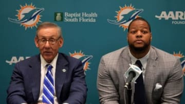 Mar 11, 2015; Davie, FL, USA; Miami Dolphins defensive tackle Ndamukong Suh (right) is flanked by Dolphins owner Stephen Ross (left) at Doctors Hospital Training Facility. Mandatory Credit: Steve Mitchell-USA TODAY Sports