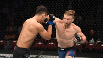 NEWARK, NJ - AUGUST 03: (R-L) Scott Holtzman punches Dong Hyun Ma of South Korea in their lightweight bout during the UFC Fight Night event at the Prudential Center on August 3, 2019 in Newark, New Jersey. (Photo by Josh Hedges/Zuffa LLC/Zuffa LLC via Getty Images)