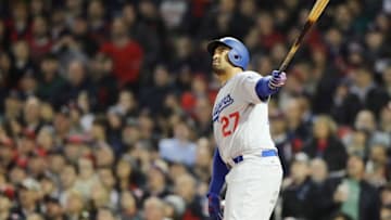 BOSTON, MA - OCTOBER 23: Matt Kemp #27 of the Los Angeles Dodgers hits a second inning home run against the Boston Red Sox in Game One of the 2018 World Series at Fenway Park on October 23, 2018 in Boston, Massachusetts. (Photo by Elsa/Getty Images)
