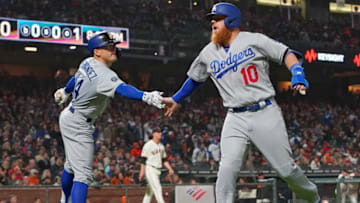 SAN FRANCISCO, CA - APRIL 29: Justin Turner #10 of the Los Angeles Dodgers is congratulated by Enrique Hernandez #14 after Turner scored against the San Francisco Giants in the top of the sixth inning of a Major League Baseball game at Oracle Park on April 29, 2019 in San Francisco, California. (Photo by Thearon W. Henderson/Getty Images)