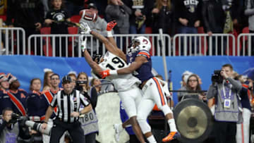ATLANTA, GA - JANUARY 01: Mike Hughes #19 of the UCF Knights and Darius Slayton #81 of the Auburn Tigers battle for the ball in the first half during the Chick-fil-A Peach Bowl at Mercedes-Benz Stadium on January 1, 2018 in Atlanta, Georgia. (Photo by Streeter Lecka/Getty Images)