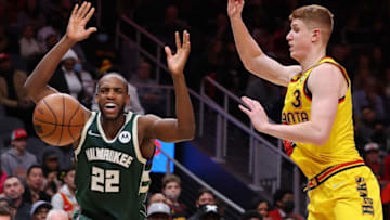 ATLANTA, GEORGIA - JANUARY 17: Khris Middleton #22 of the Milwaukee Bucks loses the ball as he drives against Kevin Huerter #3 of the Atlanta Hawks during the second half at State Farm Arena on January 17, 2022 in Atlanta, Georgia. NOTE TO USER: User expressly acknowledges and agrees that, by downloading and or using this photograph, User is consenting to the terms and conditions of the Getty Images License Agreement. (Photo by Kevin C. Cox/Getty Images)
