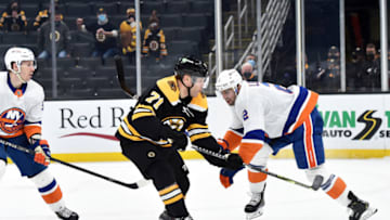 May 10, 2021; Boston, Massachusetts, USA; Boston Bruins left wing Taylor Hall (71) scores the winning goal in overtime while New York Islanders defenseman Nick Leddy (2) defends at TD Garden. Mandatory Credit: Bob DeChiara-USA TODAY Sports