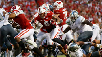 Sep 11, 2021; Madison, Wisconsin, USA; Wisconsin Badgers running back Jalen Berger (8) rushes for a touchdown during the second quarter against the Eastern Michigan Eagles at Camp Randall Stadium. Mandatory Credit: Jeff Hanisch-USA TODAY Sports