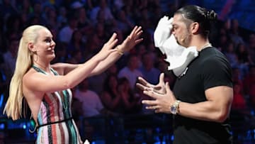 SANTA MONICA, CA - JULY 19: Skier Lindsey Vonn (L) and WWE wrestler Roman Reigns participate in a challenge onstage during the Nickelodeon Kids' Choice Sports 2018 at Barker Hangar on July 19, 2018 in Santa Monica, California. (Photo by Emma McIntyre/VMN18/Getty Images For Nickelodeon)