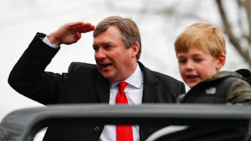 ATHENS, GA - JANUARY 15: Head coach Kirby Smart of the Georgia Bulldogs reacts while riding with his son during the parade honoring the Georgia Bulldogs national championship victory on January 15, 2022 in Athens, Georgia. (Photo by Todd Kirkland/Getty Images)