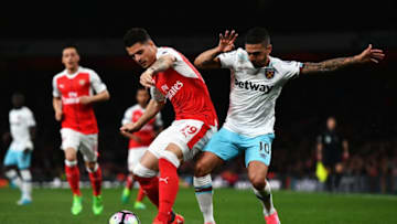 LONDON, ENGLAND - APRIL 05: Granit Xhaka of Arsenal (L) and Manuel Lanzini of West Ham United (R) battle for possession during the Premier League match between Arsenal and West Ham United at the Emirates Stadium on April 5, 2017 in London, England. (Photo by Dan Mullan/Getty Images)