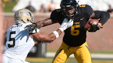 COLUMBIA, MO - OCTOBER 21: J'Mon Moore #6 of the Missouri Tigers tries to escape a tackle by Lloyd Hightower #5 of the Idaho Vandalsin the first quarter at Memorial Stadium on October 21, 2017 in Columbia, Missouri. (Photo by Ed Zurga/Getty Images)