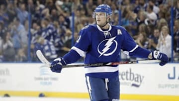 Oct 10, 2013; Tampa, FL, USA; Tampa Bay Lightning center Steven Stamkos (91) reacts after he scored a goal for a hat trick as fans throw their hats on the ice during the third period against the Florida Panthers at Tampa Bay Times Forum. The Lightnings won 7-2. Mandatory Credit: Kim Klement-USA TODAY Sports