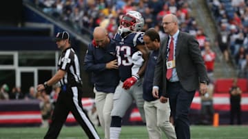 FOXBOROUGH, MA - SEPTEMBER 09: Jeremy Hill #33 of the New England Patriots is assisted by training staff after suffering an apparent injury during the second half against the Houston Texans at Gillette Stadium on September 9, 2018 in Foxborough, Massachusetts. (Photo by Jim Rogash/Getty Images)