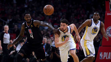 LOS ANGELES, CALIFORNIA - APRIL 26: Klay Thompson #11 of the Golden State Warriors steals the ball from JaMychal Green #4 of the LA Clippers in the first half during Game Six of Round One of the 2019 NBA Playoffs at Staples Center on April 26, 2019 in Los Angeles, California. (Photo by Harry How/Getty Images) NOTE TO USER: User expressly acknowledges and agrees that, by downloading and or using this photograph, User is consenting to the terms and conditions of the Getty Images License Agreement.