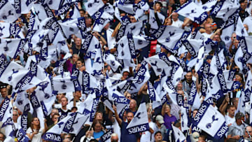LONDON, ENGLAND - AUGUST 20: Tottenham Hotspur fans wave club flags before the Premier League match between Tottenham Hotspur and Chelsea at Wembley Stadium on August 20, 2017 in London, England. (Photo by Chris Brunskill Ltd/Getty Images)