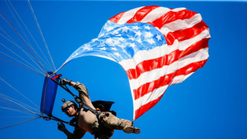 KANSAS CITY, MO - SEPTEMBER 23: A skydiver with the American Flag in tow jumps to the field halftime of the game between the Kansas City Chiefs and the San Francisco 49ers at Arrowhead Stadium on September 23rd, 2018 in Kansas City, Missouri. (Photo by David Eulitt/Getty Images)