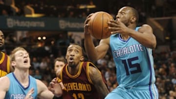 Dec 31, 2016; Charlotte, NC, USA; Charlotte Hornets guard Kemba Walker (15) drives to the basket as he is defended by Cleveland Cavaliers guard Jordan McRae (12) during the second half of the game at the Spectrum Center. Cavalier win 121-109. Mandatory Credit: Sam Sharpe-USA TODAY Sports
