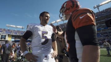 Sep 7, 2014; Baltimore, MD, USA; Baltimore Ravens quarterback Joe Flacco (5) speaks with Cincinnati Bengals quarterback Andy Dalton (14) after the game at M&T Bank Stadium. Cincinnati Bengals defeated Baltimore Ravens 23-16. Mandatory Credit: Tommy Gilligan-USA TODAY Sports