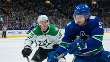 Nov 7, 2021; Vancouver, British Columbia, CAN;Dallas Stars forward Joel Kiviranta (25) checks Vancouver Canucks defenseman Tucker Poolman (5) in the second period at Rogers Arena. Mandatory Credit: Bob Frid-USA TODAY Sports