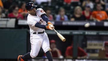 Sep 2, 2014; Houston, TX, USA; Houston Astros second baseman Jose Altuve (27) drives in a run with a double during the eighth inning against the Los Angeles Angels at Minute Maid Park. Mandatory Credit: Troy Taormina-USA TODAY Sports