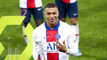 BREST, FRANCE - MAY 23: Kylian Mbappe of PSG receives the trophy of 'best scorer' of the season following the Ligue 1 match between Stade Brestois 29 and Paris Saint-Germain (PSG) at Stade Francis Le Ble on May 23, 2021 in Brest, France. (Photo by John Berry/Getty Images)