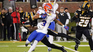 Nov 18, 2023; Columbia, Missouri, USA; Florida Gators wide receiver Eugene Wilson III (3) returns a kickoff as Missouri Tigers wide receiver Ja'Marion Wayne (25) makes the tackle during the second half at Faurot Field at Memorial Stadium. Mandatory Credit: Denny Medley-USA TODAY Sports