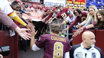 Oct 25, 2015; Landover, MD, USA; Washington Redskins quarterback Kirk Cousins (8) is congratulated by fans after the game between the Washington Redskins and the Tampa Bay Buccaneers at FedEx Field. The Washington Redskins won 31 - 30. Mandatory Credit: Brad Mills-USA TODAY Sports