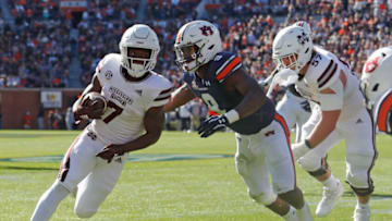 Auburn footballNov 13, 2021; Auburn, Alabama, USA; Auburn Tigers linebacker Zakoby McClain (9) closes in on Mississippi State Bulldogs running back Jo'quavious Marks (7) during the third quarter at Jordan-Hare Stadium. Mandatory Credit: John Reed-USA TODAY Sports