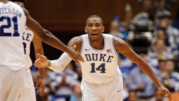 Jan 3, 2015; Durham, NC, USA; Duke Blue Devils guard Rasheed Sulaimon (14) celebrates with teammate forward Amile Jefferson (21) after scoring against the Boston College Eagles in their game at Cameron Indoor Stadium. Mandatory Credit: Mark Dolejs-USA TODAY Sports