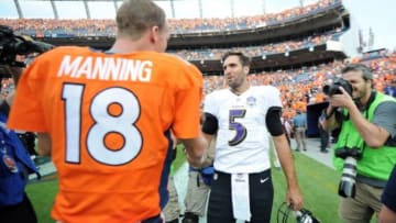 Sep 13, 2015; Denver, CO, USA; Baltimore Ravens quarterback Joe Flacco (5) shakes hands with Denver Broncos quarterback Peyton Manning (18) after their game at Sports Authority Field at Mile High. The Broncos won 19-13. Mandatory Credit: Ron Chenoy-USA TODAY Sports