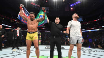 TAMPA, FLORIDA - OCTOBER 12: (L-R) Eryk Anders celebrates his victory over Gerald Meerschaert in their middleweight bout during the UFC Fight Night event at Amalie Arena on October 12, 2019 in Tampa, Florida. (Photo by Josh Hedges/Zuffa LLC via Getty Images)