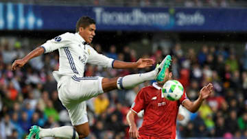 Real Madrid's French defender Raphael Varane (L) and Sevilla's Argentinian midfielder Franco Vazquez vie for the ball during the UEFA Super Cup final football match between Real Madrid CF and Sevilla FC on August 9, 2016 at the Lerkendal Stadium in Trondheim. / AFP / JONATHAN NACKSTRAND (Photo credit should read JONATHAN NACKSTRAND/AFP/Getty Images)