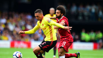 WATFORD, ENGLAND - AUGUST 12: Jose Holebas of Watford is tackled by Mohamed Salah of Liverpool during the Premier League match between Watford and Liverpool at Vicarage Road on August 12, 2017 in Watford, England. (Photo by Tony Marshall/Getty Images)
