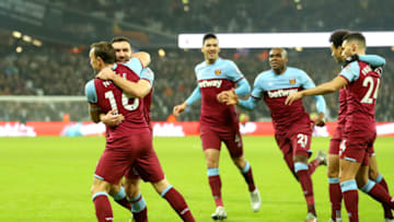 LONDON, ENGLAND - JANUARY 01: Mark Noble of West Ham United celebrates with Robert Snodgrass after scoring his team's first goal during the Premier League match between West Ham United and AFC Bournemouth at London Stadium on January 01, 2020 in London, United Kingdom. (Photo by Warren Little/Getty Images)