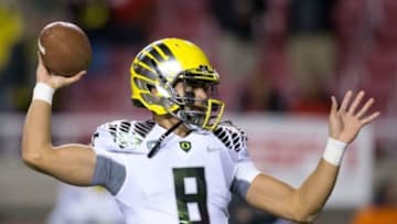 Nov 8, 2014; Salt Lake City, UT, USA; Oregon Ducks quarterback Marcus Mariota (8) warms up prior to the game against the Utah Utes at Rice-Eccles Stadium. Mandatory Credit: Russ Isabella-USA TODAY Sports