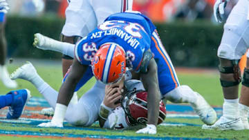 Florida Gators defensive lineman Princely Umanmielen (33) sacks South Carolina Gamecocks quarterback Spencer Rattler (7) during first half action as Florida takes on South Carolina at Steve Spurrier Field at Ben Hill Griffin Stadium in Gainesville, FL on Saturday, November 12, 2022. [Alan Youngblood/Gainesville Sun]Ncaa Football Florida Gators Vs South Carolina