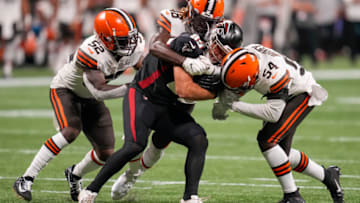 Aug 29, 2021; Atlanta, Georgia, USA; Atlanta Falcons tight end John Raine (89) is tackled by Cleveland Browns linebacker Elijah Lee (52) safety Elijah Benton (48) and linebacker Willie Harvey Jr. (54) during the second half at Mercedes-Benz Stadium. Mandatory Credit: Dale Zanine-USA TODAY Sports
