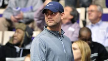 Dec 22, 2014; Evanston, IL, USA; Chicago Cubs president Theo Epstein watches a game between the Northwestern Wildcats and the Illinois-Chicago Flames during the second half at Welsh-Ryan Arena. The Northwestern Wildcats defeated the Illinois-Chicago Flames 63-46. Mandatory Credit: David Banks-USA TODAY Sports