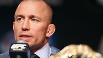 LAS VEGAS, NV - NOVEMBER 14: UFC welterweight champion Georges St-Pierre interacts with media during the final UFC 167 pre-fight press conference inside the Hollywood Theatre at the MGM Grand Hotel/Casino on November 14, 2013 in Las Vegas, Nevada. (Photo by Josh Hedges/Zuffa LLC/Zuffa LLC via Getty Images)