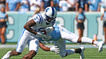 CHAPEL HILL, NORTH CAROLINA - OCTOBER 02: Ja'Qurious Conley #0 of the North Carolina Tar Heels tackles Jalon Calhoun #5 of the Duke Blue Devils during the first half of their game at Kenan Memorial Stadium on October 02, 2021 in Chapel Hill, North Carolina. (Photo by Grant Halverson/Getty Images)