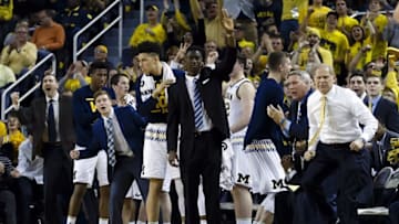 Mar 5, 2016; Ann Arbor, MI, USA; Michigan Wolverines head coach John Beilein (right) and players celebrate a three point basket in the first half against the Iowa Hawkeyes at Crisler Center. Mandatory Credit: Rick Osentoski-USA TODAY Sports