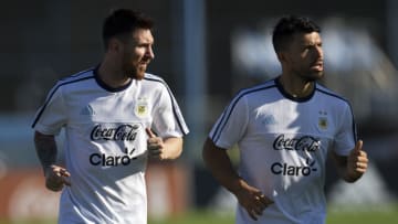 Lionel Messi and Sergio Aguero jog during a training session in Ezeiza, Buenos Aires. (Photo credit should read EITAN ABRAMOVICH/AFP via Getty Images)