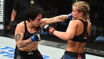 ST. LOUIS, MO - JANUARY 14: (L-R) Jessica-Rose Clark of Australia punches Paige VanZant in their women's flyweight bout during the UFC Fight Night event inside the Scottrade Center on January 14, 2018 in St. Louis, Missouri. (Photo by Josh Hedges/Zuffa LLC/Zuffa LLC via Getty Images)